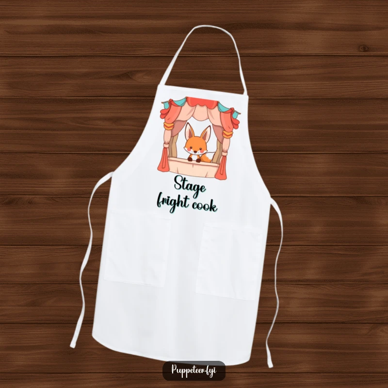 Funny playful fox peeking from behind a large, whimsical puppet stage, durable kitchen apron, adding theatrical humor to cooking.